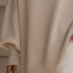 Beige knit jumper hem and sleeve cuff with ribbed trim, drop-shoulder style