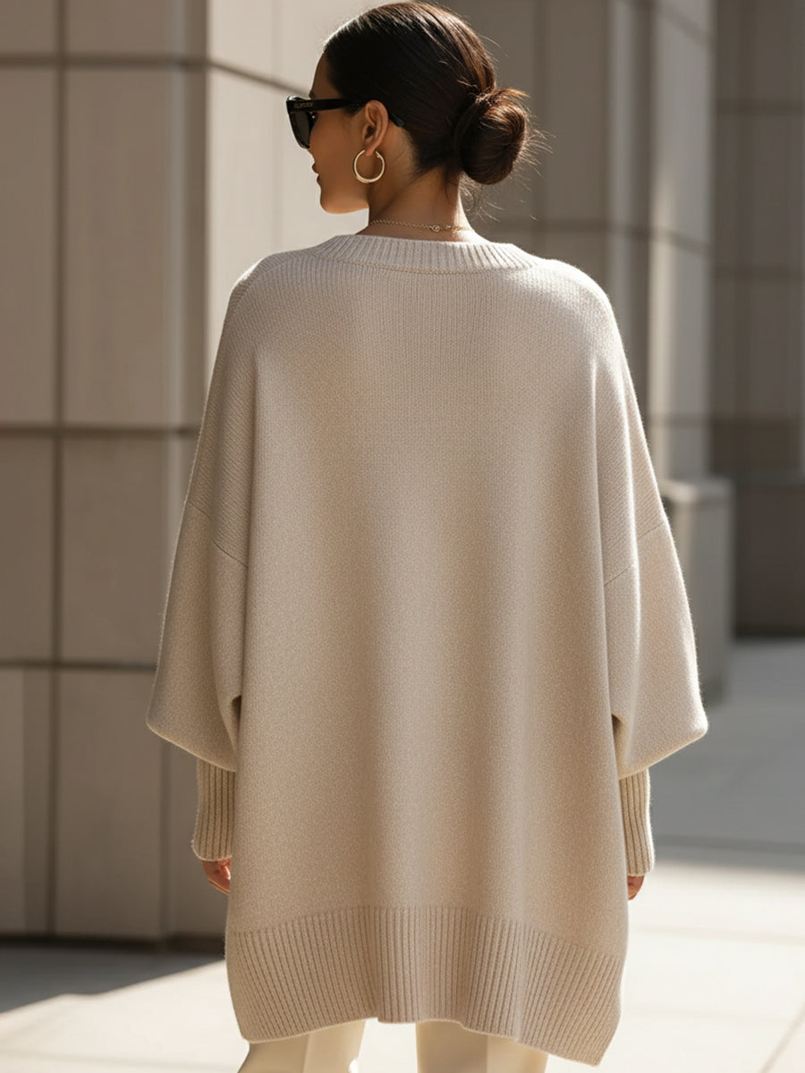 Beige drop-shoulder knit jumper back view with ribbed crew neck and hem