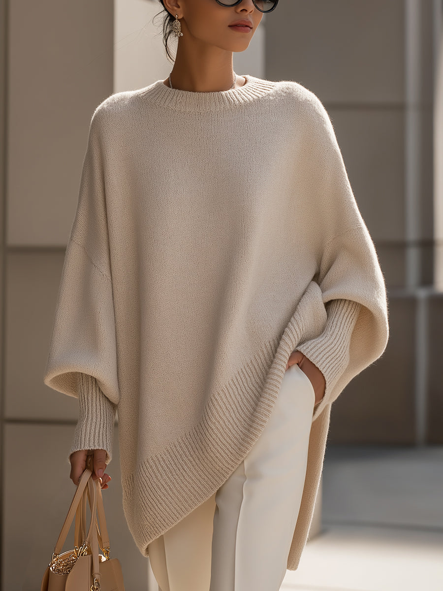 Beige drop-shoulder knit jumper with ribbed crew neck and asymmetrical hem