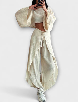 Loose-fit two-piece set with cropped top and draped wide-leg pants, light beige