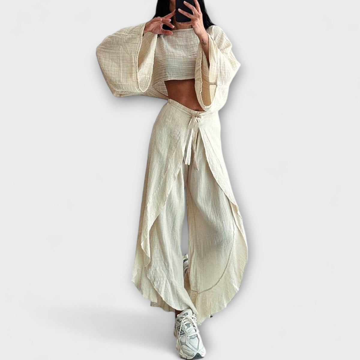 Loose-fit two-piece set with cropped top and draped wide-leg pants, light beige