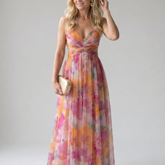 Multicolor maxi wrap dress with V-neck, sleeveless bodice, and twisted waist detail.