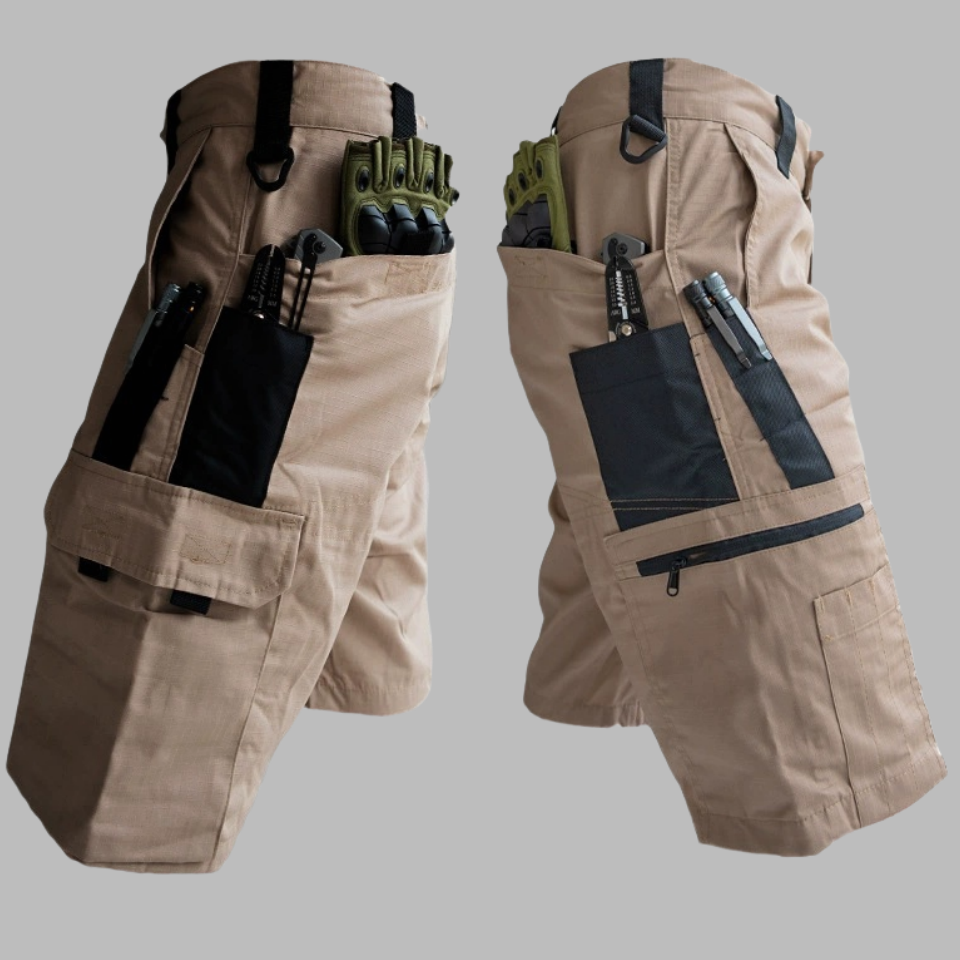 Tan tactical shorts with elastic waistband, multi-pocket design, and side tool straps