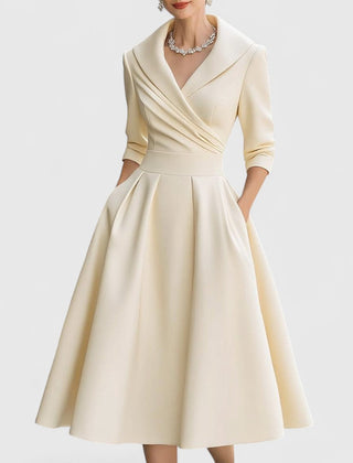 Beige midi dress with surplice V-neck, three-quarter sleeves, and pleated full skirt