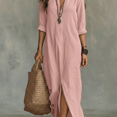 Pink button-front maxi dress with V-neck, three-quarter sleeves, and side slit