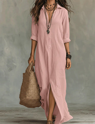 Pink button-front maxi dress with V-neck, three-quarter sleeves, and side slit