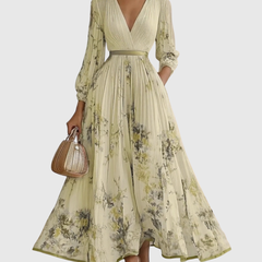 Lime-green pleated maxi dress with V-neck, gathered waist and floral print, long sleeves.