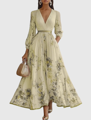 Lime-green pleated maxi dress with V-neck, gathered waist and floral print, long sleeves.