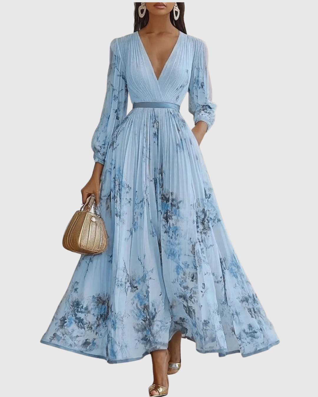Light blue pleated maxi dress with V-neck, gathered waist and blue floral print, long sleeves.
