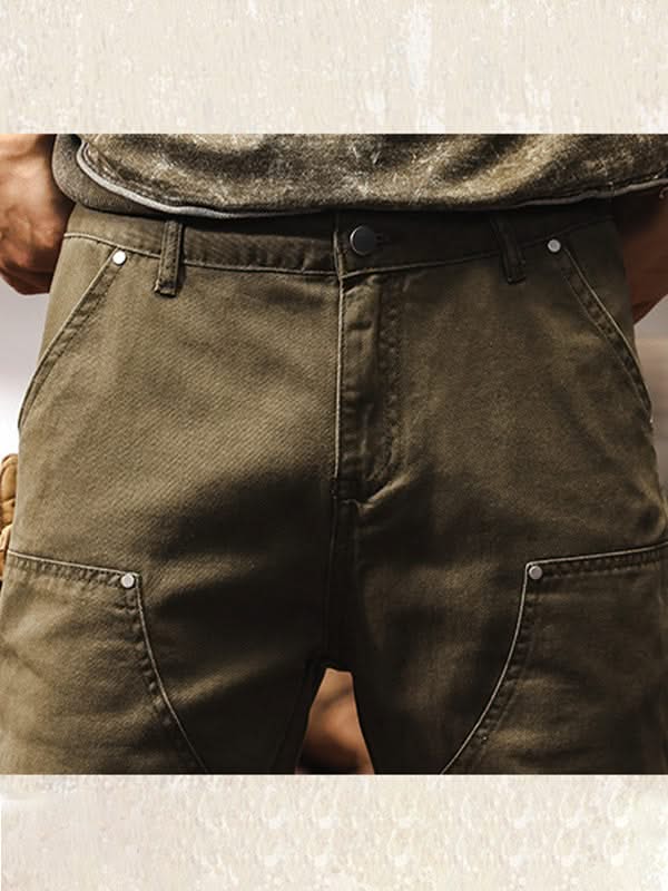 Army green utility pants close-up of waistband, button, and front fly