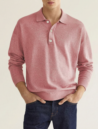 Pink wool polo shirt with long sleeves, button placket, and ribbed cuffs