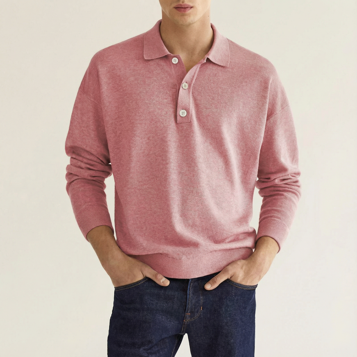 Pink wool polo shirt with long sleeves, button placket, and ribbed cuffs