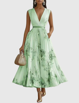 Green pleated maxi dress with V-neck, gathered waist and sleeveless bodice.