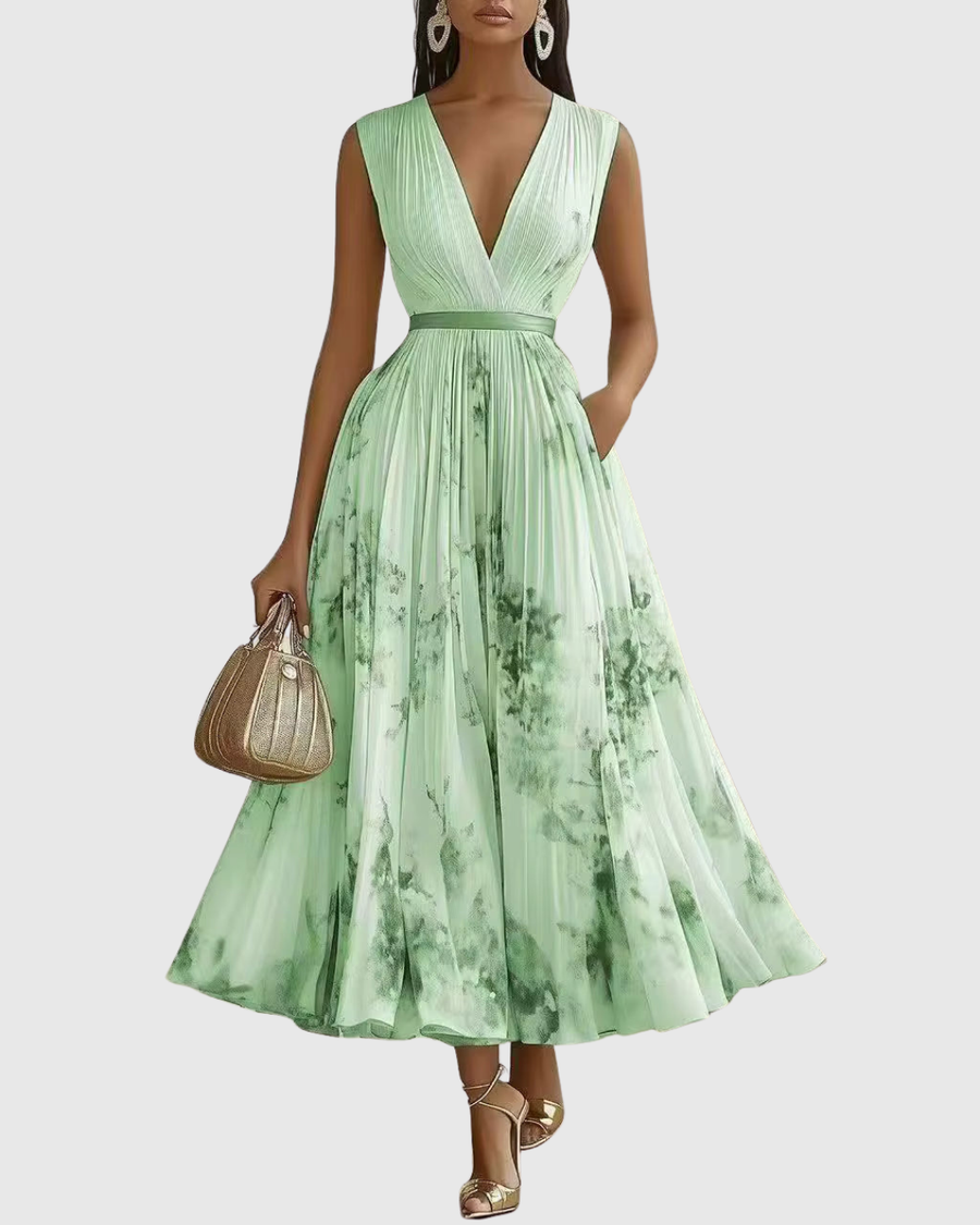 Green pleated maxi dress with V-neck, gathered waist and sleeveless bodice.