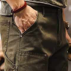 Army green utility pants close-up of right front pocket and belt loop