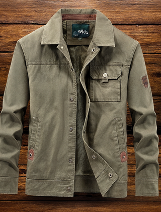 Green utility jacket with button front, flap pockets, and diagonal inner lining