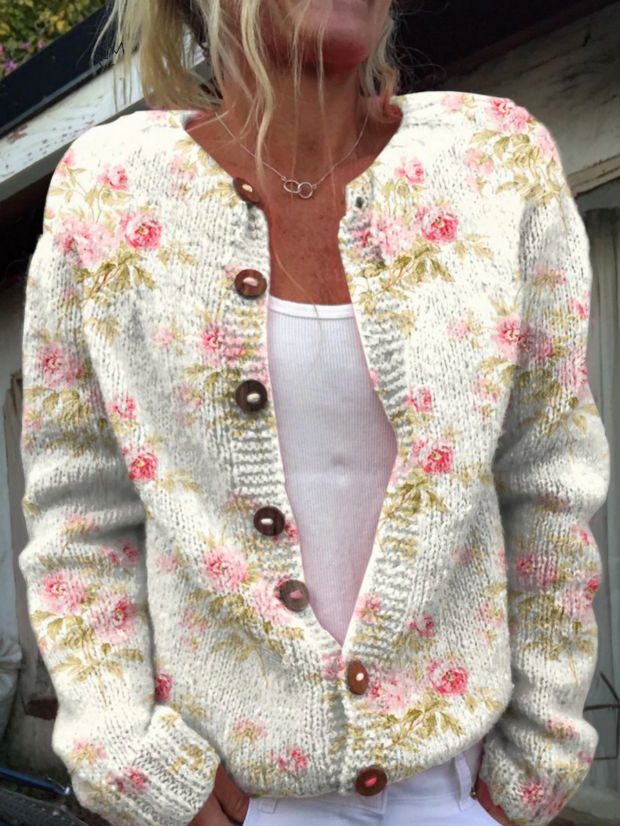 Women’s vintage knit cardigan sweater in cream with pink floral print, button front, V-neck