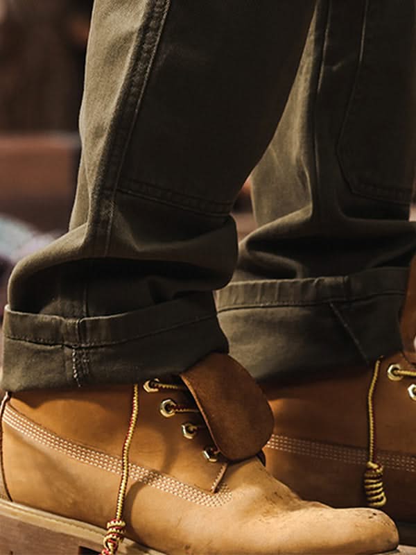 Army green straight-leg utility work pants with cuffed hem and side pockets