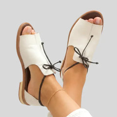 White leather lace-up ankle strap sandals with open toe and flat sole