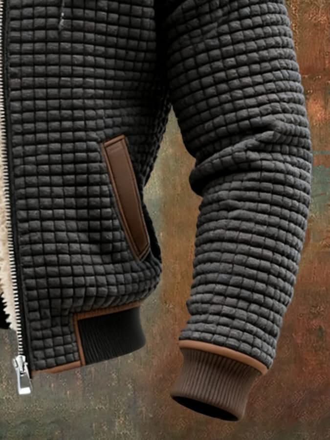 Black quilted fleece sleeve and pocket with brown trim and ribbed knit cuffs