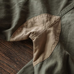 Army green M-47 HBT trouser cuff with beige reinforced patch