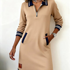 Beige long-sleeve dress with quarter-zip, contrast collar, navy-striped hem and cuffs