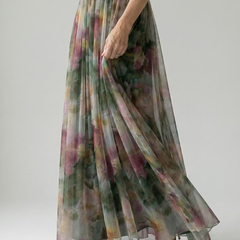 Floral print maxi dress with twist-front bodice and flowing tiered skirt, side view
