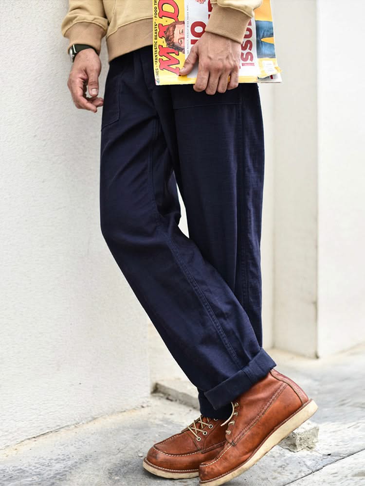 Navy straight fatigue pants with button-fly and side pockets