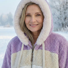 Colourblock plush jacket with purple hood trim and cream sherpa panels, zip front