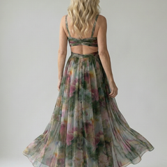 Floral print maxi dress back view with crisscross straps and full gathered skirt