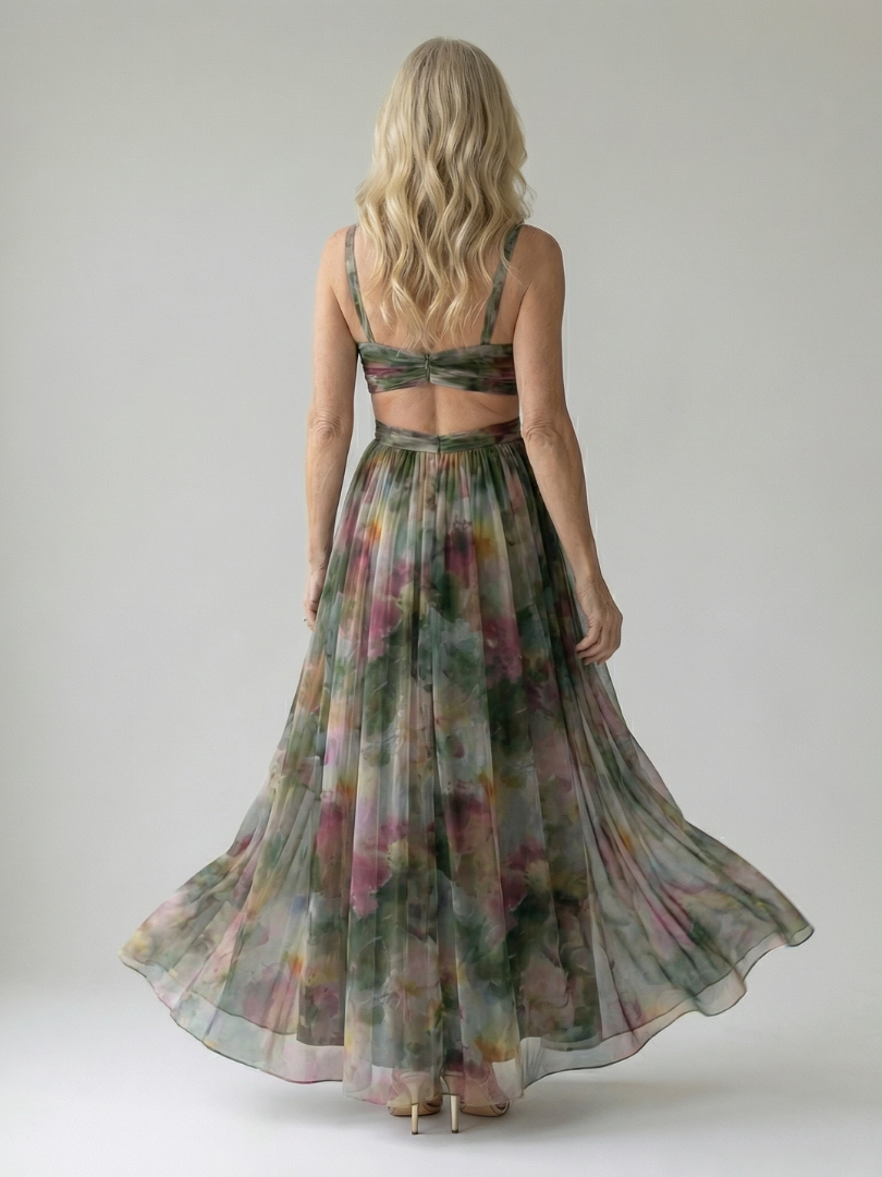 Floral print maxi dress back view with crisscross straps and full gathered skirt