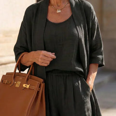 Black 3-piece outfit set close-up: scoop tank, elastic-waist wide-leg pants, kimono layer