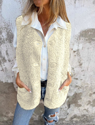Etta women’s short warm vest in cream, button-front with flap pockets.