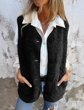 Etta women’s short warm vest in black, button-front with flap pockets.