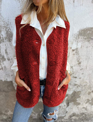 Etta women’s short warm vest in red, button-front with flap pockets.