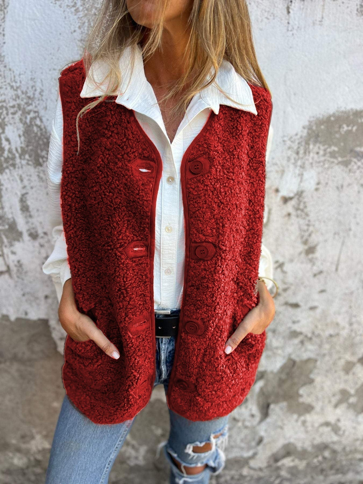 Etta women’s short warm vest in red, button-front with flap pockets.