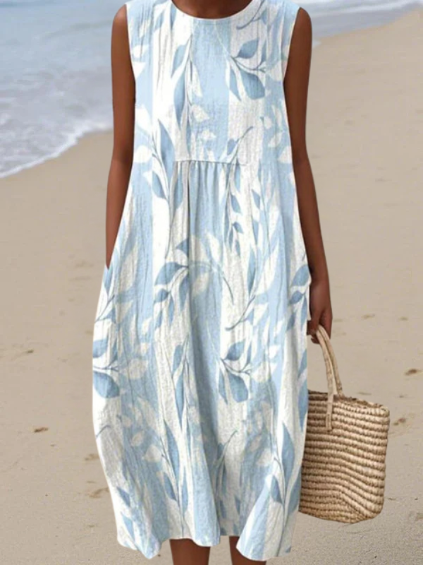 Leaf print midi dress, sleeveless with round neckline and gathered waist in blue-and-white.