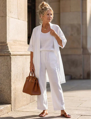 3-piece set in white with long tunic over tank top and wide-leg pants.