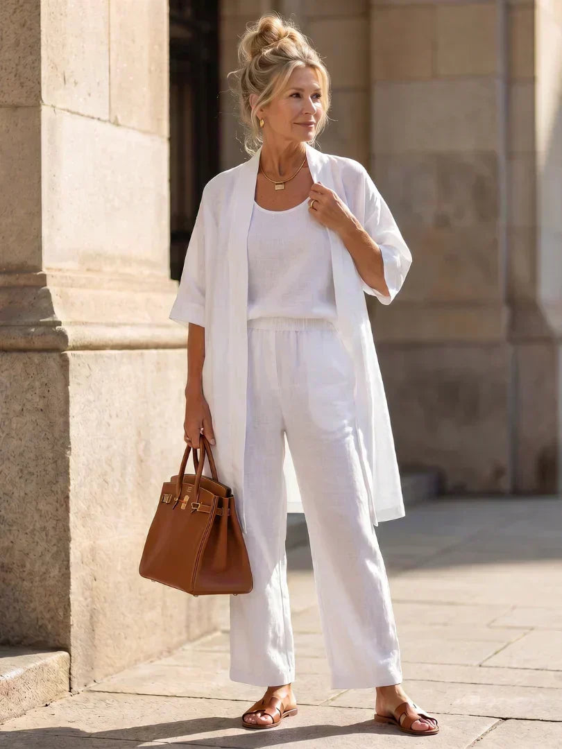 3-piece set in white with long tunic over tank top and wide-leg pants.