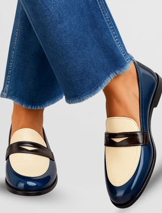 Blue loafers with cream upper and black strap detail, low heel slip-on