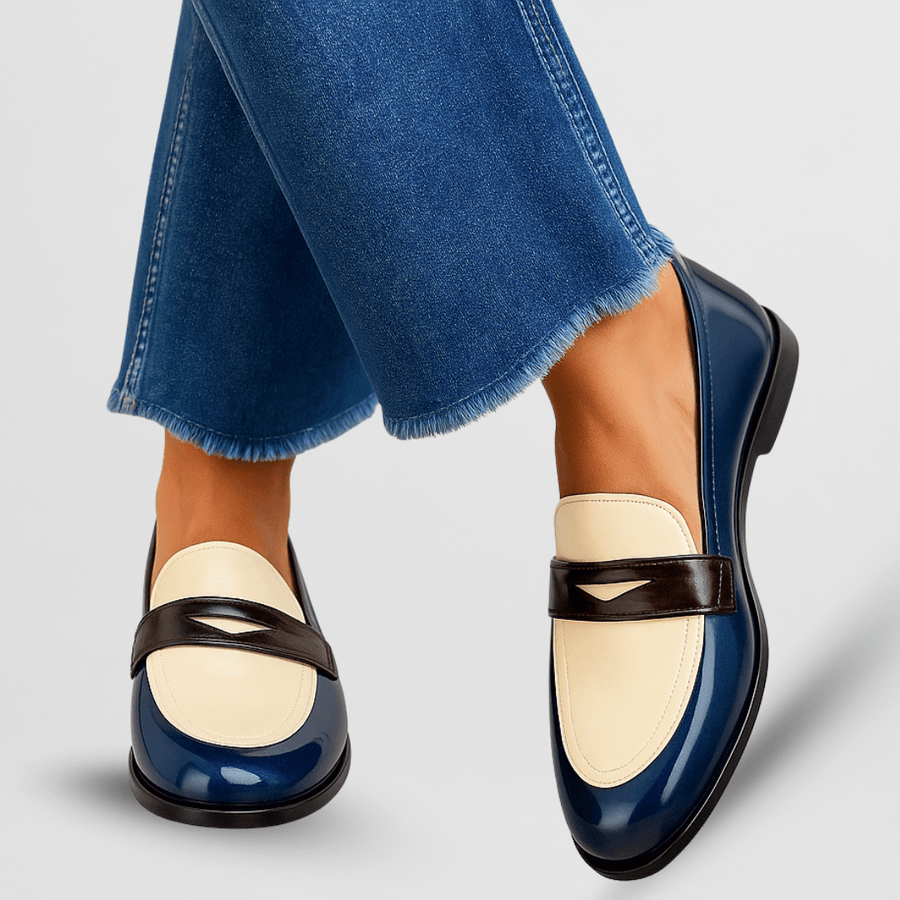 Blue loafers with cream upper and black strap detail, low heel slip-on