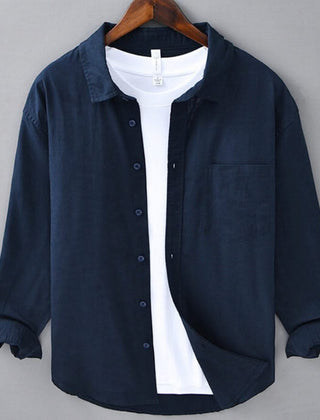 Navy linen button-up shirt with point collar, chest pocket, and dark buttons
