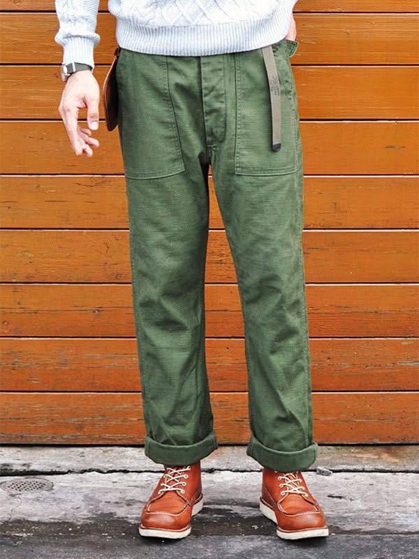 Olive green straight fatigue pants with front slash pockets and flap cargo pockets