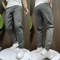 Dark grey utility pants with cargo pockets and cuffed ankle hem