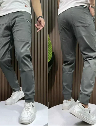 Dark grey utility pants with cargo pockets and cuffed ankle hem