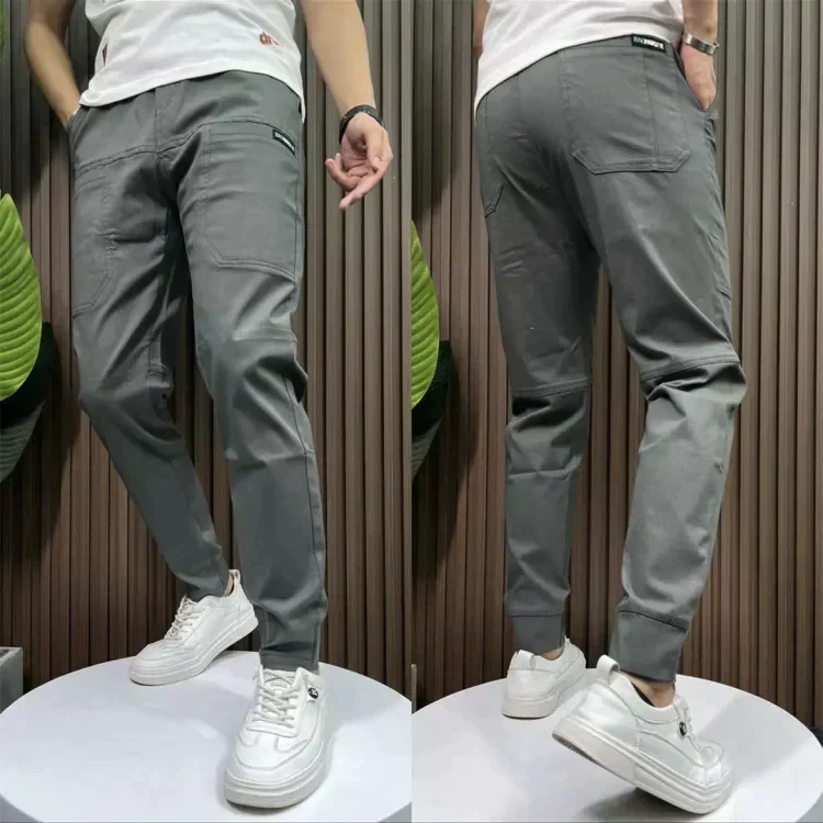 Dark grey utility pants with cargo pockets and cuffed ankle hem