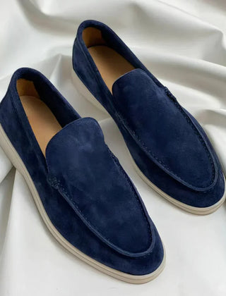 Blue suede loafer slip-on with moc stitching and white rubber sole