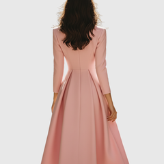 Back view of blazer-style pleated midi dress in blush pink with long sleeves and seams