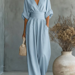 Sky-blue V-neck high-waisted jumpsuit with long sleeves and wide-leg pants