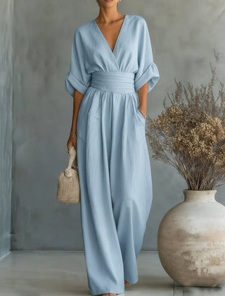 Sky-blue V-neck high-waisted jumpsuit with long sleeves and wide-leg pants